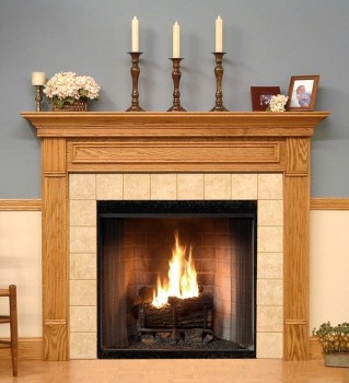 The Forestdale custom fireplace is show in one of the six wood type options available.