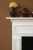 The pop out wood frames are carefully carved into the custom made fireplace mantel.