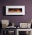 A beautiful white limestone fireplace facing allows this electric fireplace to fit well with almost any decor.