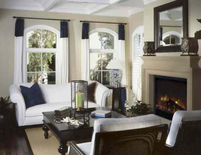 An electric fireplace can be fitted into a mantel, to bring warmth and ambiance to any room, including a formal living room.