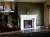 Upgraded room with an installed Empire stone mantel.