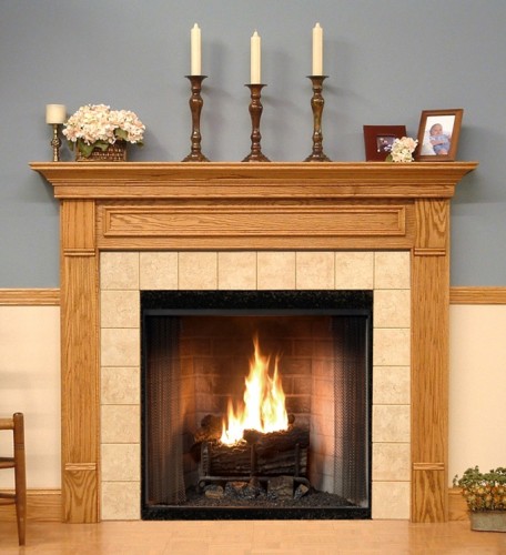 The Forestdale custom fireplace is show in one of the six wood type options available.