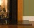 Up close picture of the details at the bottom of the mantel.