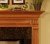 The carefully crafted crown molding boost the quality of the Saratoga custom wood fireplace.