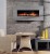 Decorator Gray Limestone facing marks this elegant wall hung electric fireplace.