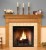 The Forestdale custom fireplace is show in one of the six wood type options available.