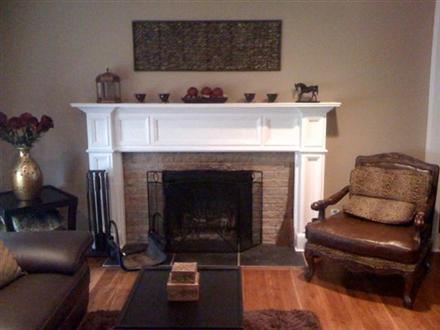 An upgraded room with the Georgetown fireplace mantel shown in a white paint grade.