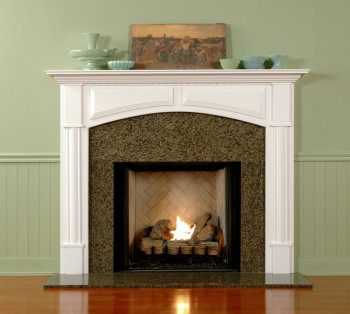 Beautiful crown molding across the header with an outset wood arched frame.