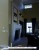Extended from the wall at slight angle stone fireplace mantel.