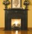 The elegant Lennox Custom Fireplace mantel is shown here with a granite facing kit.